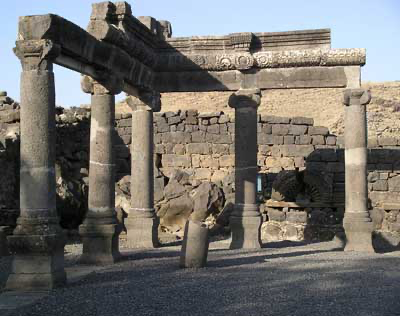 A stone structure with pillars

Description automatically generated