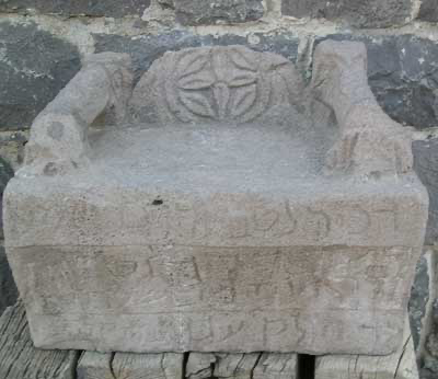 A stone object with carved designs

Description automatically generated with medium confidence