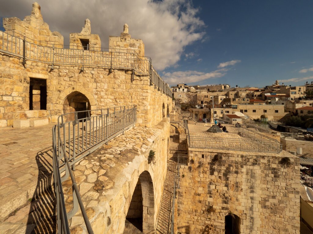 A stone bridge over a city
AI-generated content may be incorrect.